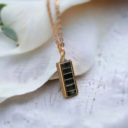 Natural Salt And Pepper Diamond Necklace Baguette Cut Pendant featuring a natural salt and pepper diamond in a baguette cut shape, showcased as a minimalist pendant necklace with organic diamond inclusions, clean geometric lines, and modern fine jewelry styling.