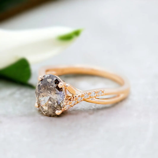 Natural Salt and Pepper Diamond Ring Oval Cut 1.60 Ct Engagement Ring featuring an oval-cut salt-and-pepper diamond center stone with round side diamonds, modern engagement ring style, and a flowing bypass shank design with elegant handcrafted detailing and organic diamond pattern.