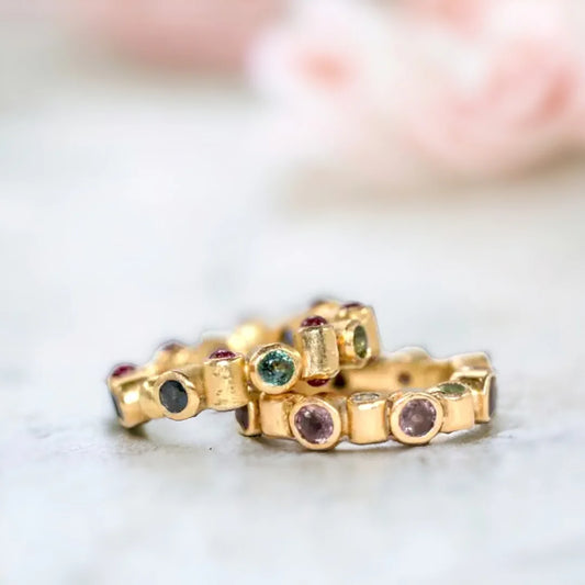 Sapphire and Ruby Band Ring with Natural Blue Sapphires featuring round and rose-cut blue sapphires and ruby accents in a handcrafted band ring design with a straight shank.