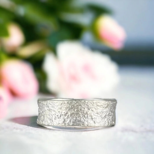 Sands of Time Wedding Band with Ocean Wave Design Solid Gold Wedding Band featuring a 7.5mm wide solid gold band with ocean wave-inspired layered handcrafted texture, straight shank design and smooth comfort fit unisex statement style ring