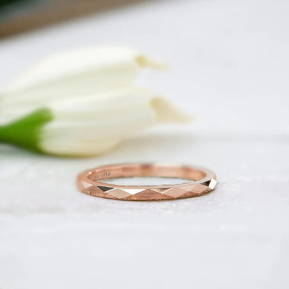 Faceted Gold Wedding Ring with Reflective Design