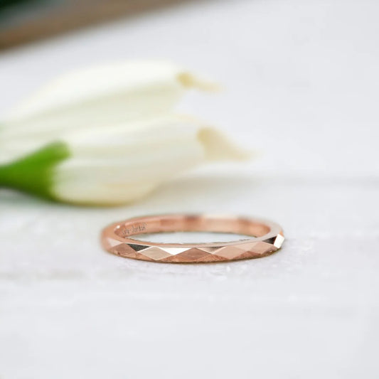 Faceted Gold Wedding Ring with Reflective Design