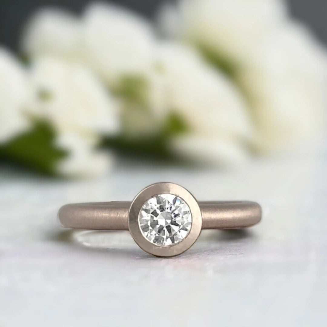 Bezel Set Solitaire Ring with Flush Diamond Design