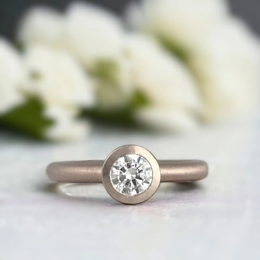 Bezel Set Solitaire Ring with Flush Diamond Design