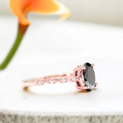 Oval Black Diamond Engagement Ring with Marquise Accents