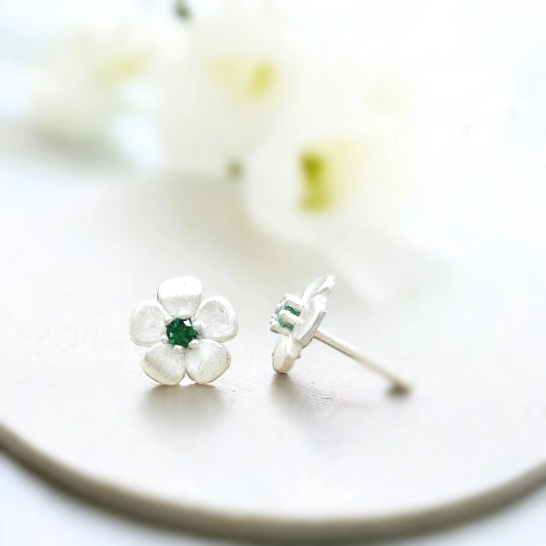 Sterling Silver Floral Stud Earrings with Green Emerald