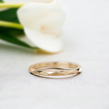 Faceted Gold Wedding Ring with Reflective Design