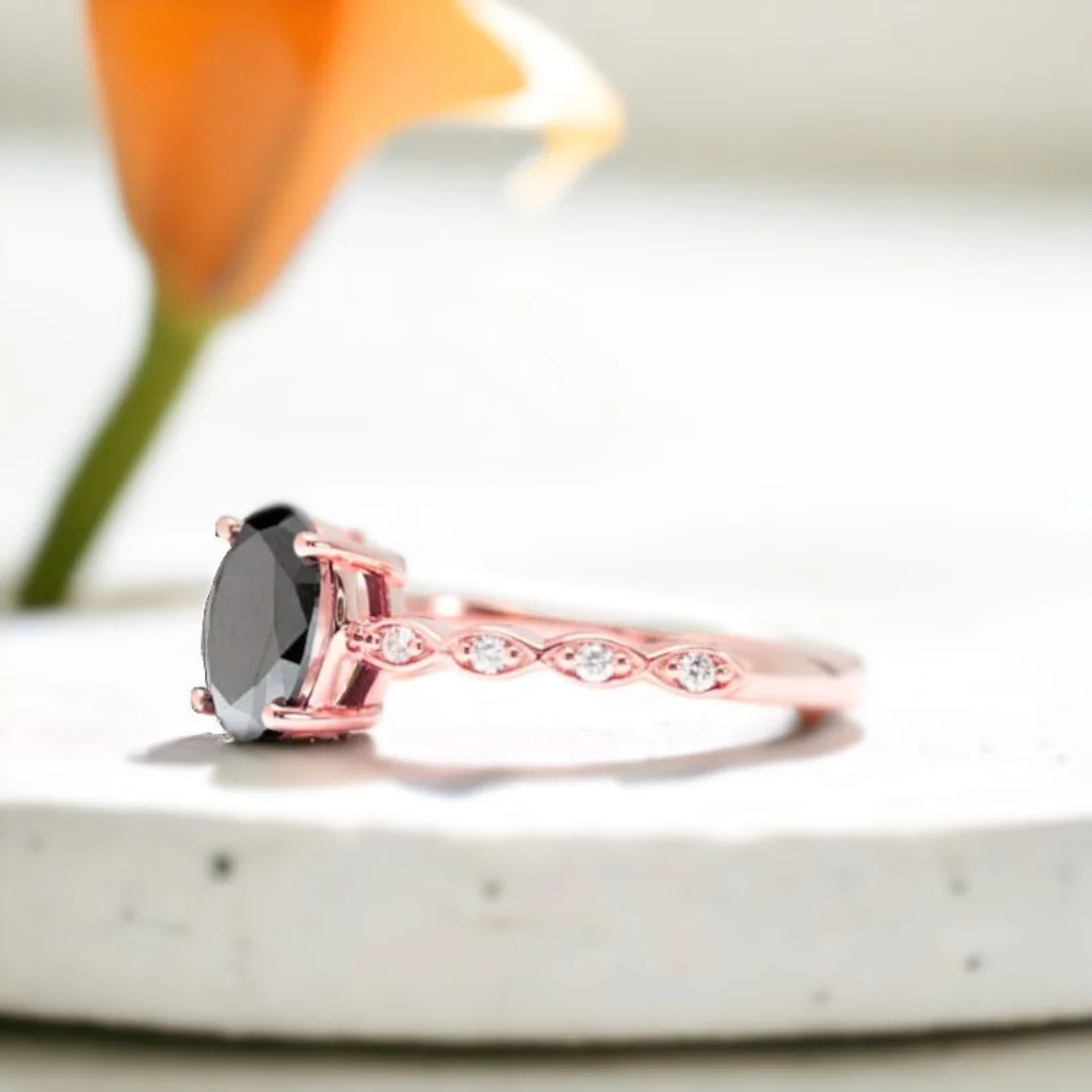 Oval Black Diamond Engagement Ring with Marquise Accents