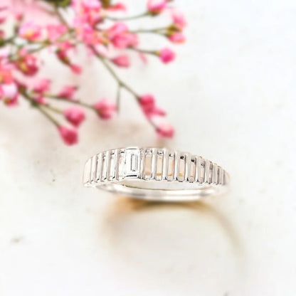 Baguette Diamond Ring in a Bold Dome Cage Design in Solid Gold featuring a natural white diamond center stone, baguette-cut diamond accents, dome-style setting, and a wide, structured band with a modern geometric design.
