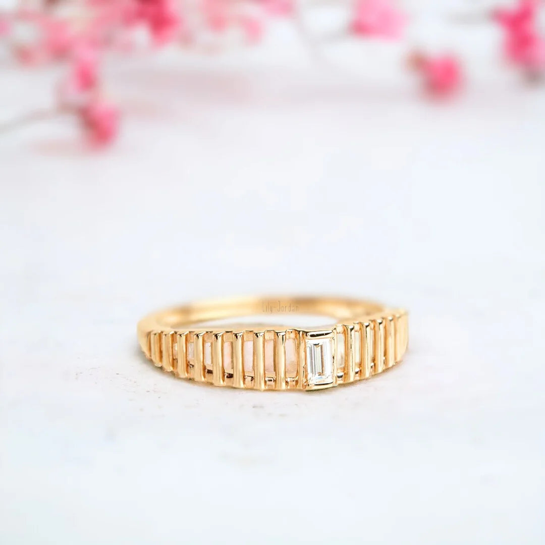 Baguette Diamond Ring in a Bold Dome Cage Design in Solid Gold featuring a natural white diamond center stone, baguette-cut diamond accents, dome-style setting, and a wide, structured band with a modern geometric design.