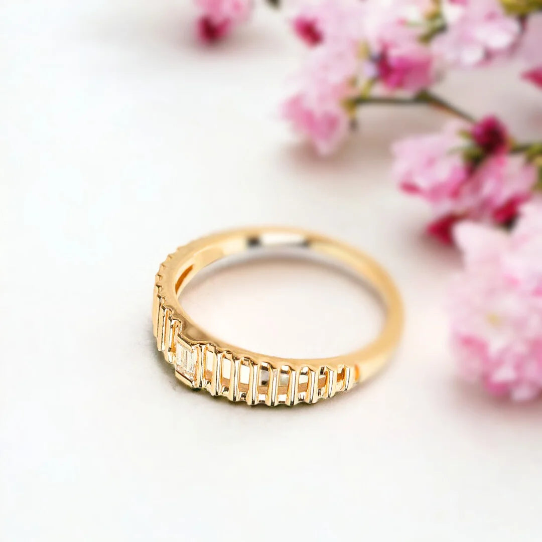 Baguette Diamond Ring in a Bold Dome Cage Design in Solid Gold featuring a natural white diamond center stone, baguette-cut diamond accents, dome-style setting, and a wide, structured band with a modern geometric design.