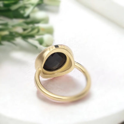 Black Salt and Pepper Diamond Ring Round Chex Cut Vintage Gold Ring featuring a round chex-cut black salt and pepper diamond center stone in vintage gold style with a straight shank band and minimal contemporary geometric design appeal.
