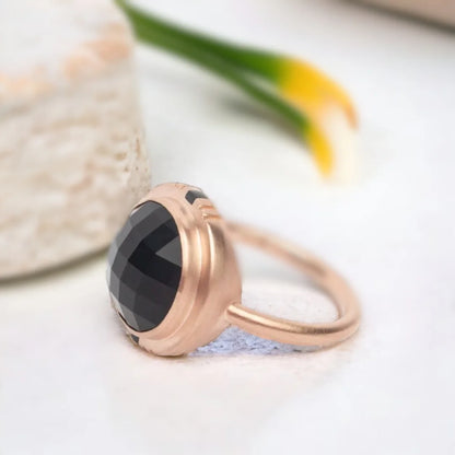Black Salt and Pepper Diamond Ring Round Chex Cut Vintage Gold Ring featuring a round chex-cut black salt and pepper diamond center stone in vintage gold style with a straight shank band and minimal contemporary geometric design appeal.