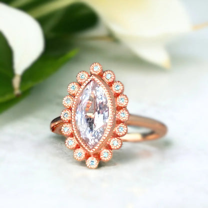 Blue Sapphire Ring Oceanic Elegance Marquise Design featuring a natural marquise-cut deep ocean blue sapphire center stone with a slim straight band and delicate blue sapphire side stones in a handcrafted fine jewelry ring