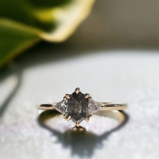 Brooklyn Wedding Rings Custom Salt and Pepper Diamond Ring featuring a hexagon-cut salt-and-pepper diamond center stone with trillion-cut side diamonds in a geometric side stone ring design and straight shank setting.