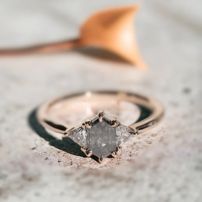 Brooklyn Wedding Rings Custom Salt and Pepper Diamond Ring featuring a hexagon-cut salt-and-pepper diamond center stone with trillion-cut side diamonds in a geometric side stone ring design and straight shank setting.