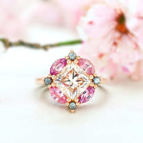 Cushion Cut Diamond Ring Cushion Mosaic Ring Teal and Pink Sapphires featuring a cushion-cut diamond centre design with teal and pink sapphire accents in a mosaic-inspired multi-stone ring style
