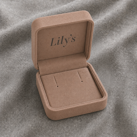 Earring Box in a blush pink finish featuring a soft cushioned interior with earring display slots, rounded square design, and Lily's logo printed inside the lid for elegant jewelry packaging and gift presentation.