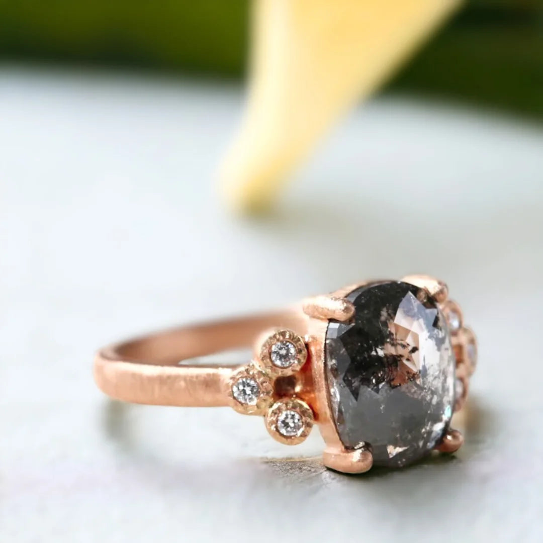 Elongated Cushion Salt-and-Pepper Diamond Ring Crystal Clarity Design featuring a rose elongated cushion-cut salt-and-pepper diamond with a 2.04 CT center stone, round side diamonds, and a straight band design in a refined engagement ring style.