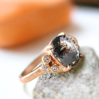 Elongated Cushion Salt-and-Pepper Diamond Ring Crystal Clarity Design featuring a rose elongated cushion-cut salt-and-pepper diamond with a 2.04 CT center stone, round side diamonds, and a straight band design in a refined engagement ring style.