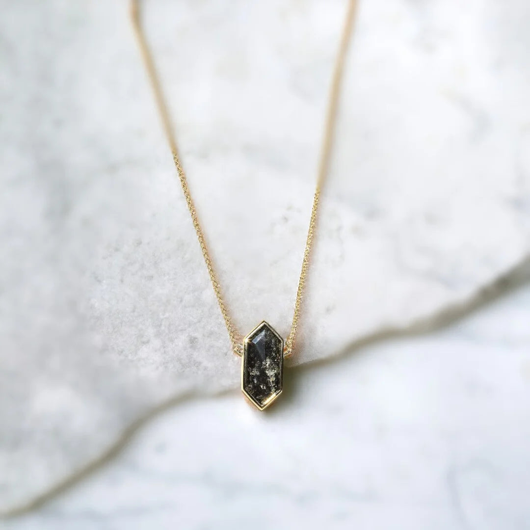 Elongated Hexagon Salt and Pepper Diamond Necklace featuring an elongated hexagon-shaped salt-and-pepper diamond with a grey-toned, raw, elegant appearance, set as a minimalist pendant on a 20-inch cable chain with a lobster-claw clasp, showcasing a modern handcrafted fine jewelry design.