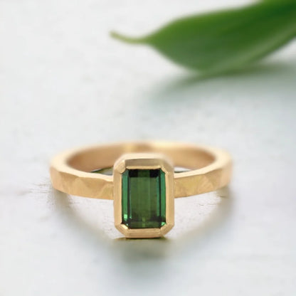 Emerald Cut Green Emerald Ring Modern Gold Ring Ethical Jewellery featuring an emerald-cut green emerald center stone set in a modern gold ring with a straight shank band and an elegant minimal geometric design highlighting ethical sourcing and fine handcrafted craftsmanship