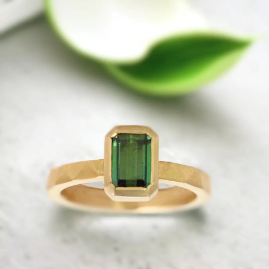 Emerald Cut Green Emerald Ring Modern Gold Ring Ethical Jewellery featuring an emerald-cut green emerald center stone set in a modern gold ring with a straight shank band and an elegant minimal geometric design highlighting ethical sourcing and fine handcrafted craftsmanship