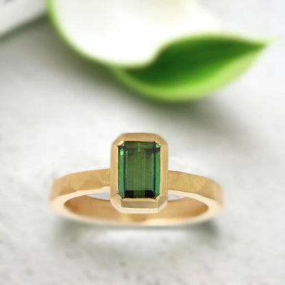 Emerald Cut Green Emerald Ring Modern Gold Ring Ethical Jewellery featuring an emerald-cut green emerald center stone set in a modern gold ring with a straight shank band and an elegant minimal geometric design highlighting ethical sourcing and fine handcrafted craftsmanship