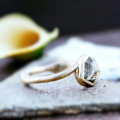 Grey Hexagon Diamond Bezel Engagement Ring, Nature-Inspired, featuring a natural salt-and-pepper shield-cut diamond in a geometric bezel setting with a bypass shank band and modern minimalist design.