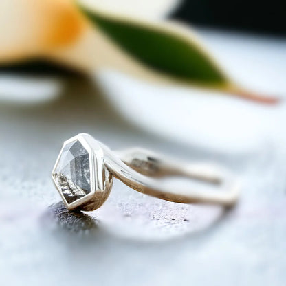 Grey Hexagon Diamond Bezel Engagement Ring, Nature-Inspired, featuring a natural salt-and-pepper shield-cut diamond in a geometric bezel setting with a bypass shank band and modern minimalist design.