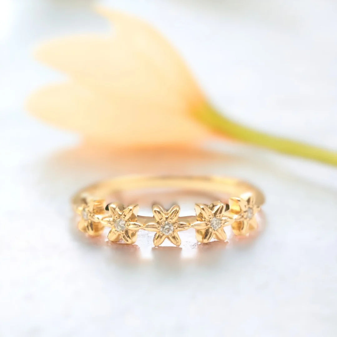 Handcrafted Diamond Flower Eternity Ring Floral Design Delicate Sparkle featuring round salt and pepper diamond with floral eternity inspired design, slim straight band, and delicate handcrafted setting