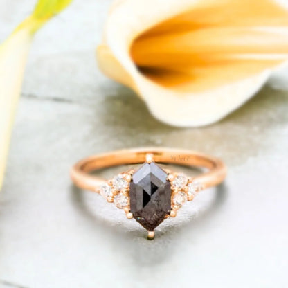 Hexagon Salt and Pepper Diamond Ring 1.90 Ct Luxury Minimalist Design featuring a hexagon-cut salt-and-pepper diamond as the center stone with natural black and white inclusions, accented by round side diamonds set along a sleek straight shank band in a modern minimalist geometric engagement ring style with clean structured symmetry and refined handcrafted detailing.