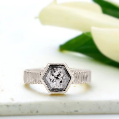 Hexagon Diamond Ring Bezel-set hexagon diamond solitaire ring featuring a hexagon-cut 1.78 CT salt-and-pepper diamond in a bezel setting with a solid gold 4.00mm wide textured band and minimalist straight shank design