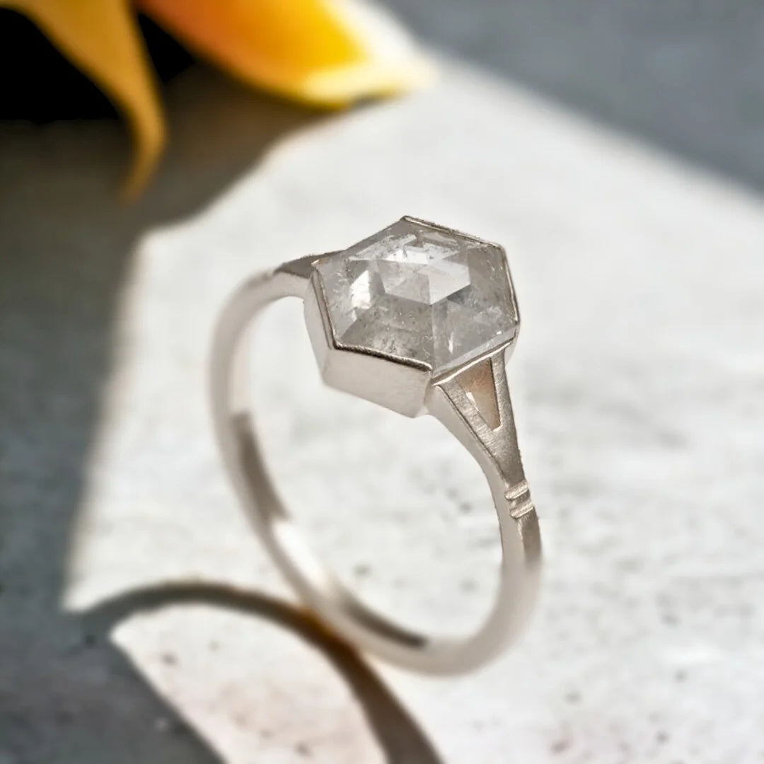 Hexagon Salt and Pepper Diamond Ring Minimal Dea Ring Rose Cut Design featuring a hexagon salt and pepper diamond center stone with organic inclusions and a sculptural split shank band in a handcrafted modern rose-cut-inspired design with elegant geometric styling.