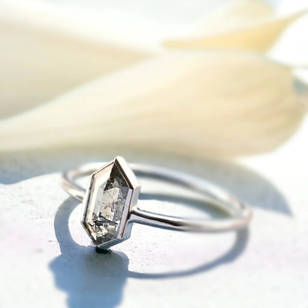 Salt And Pepper Rose Oval Diamond Ring Vintage Solitaire Design featuring a 1.22 CT hexagon cut salt and pepper diamond in a solitaire setting with a straight shank band and minimalist geometric ring design.
