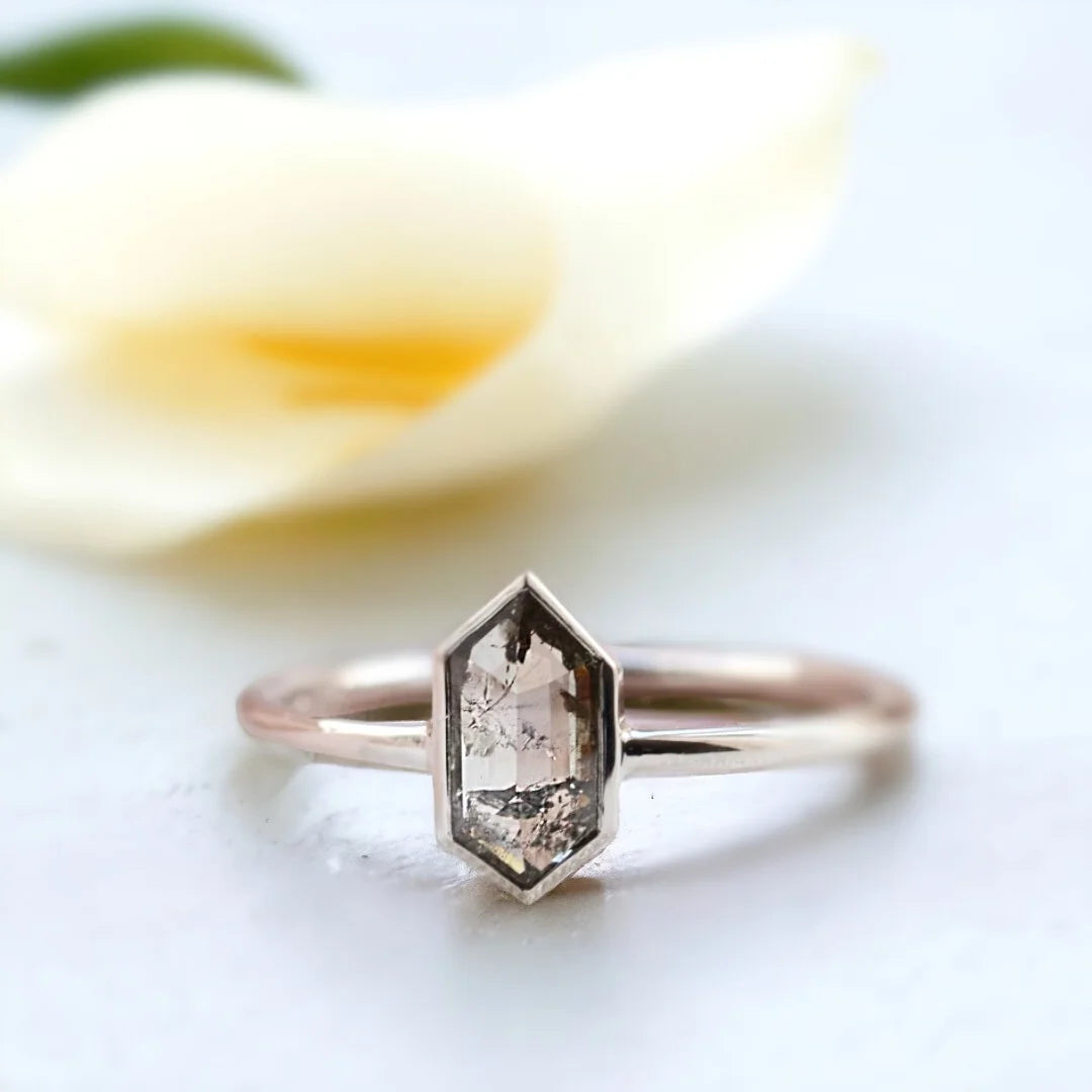 Salt And Pepper Rose Oval Diamond Ring Vintage Solitaire Design featuring a 1.22 CT hexagon cut salt and pepper diamond in a solitaire setting with a straight shank band and minimalist geometric ring design.