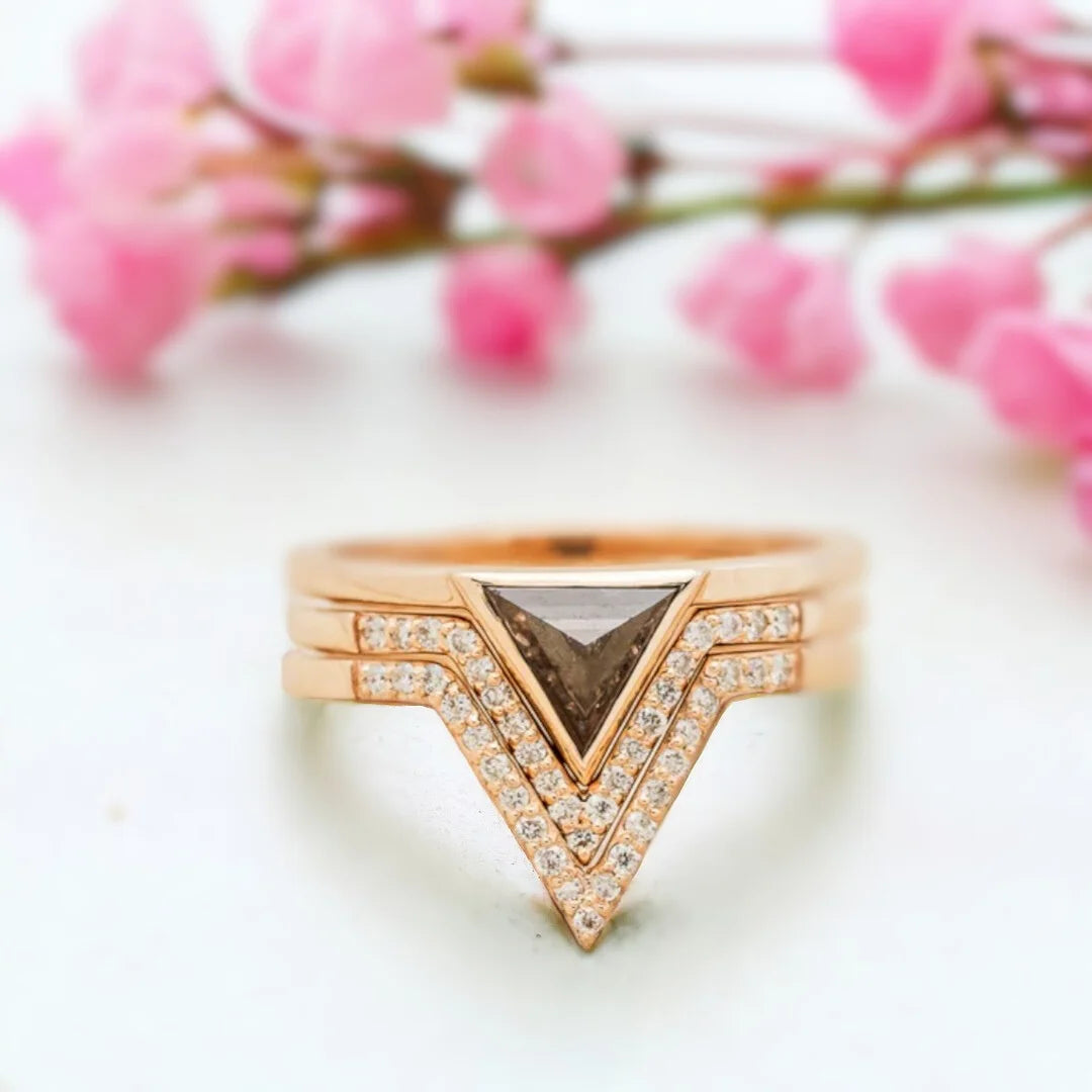 Jenny Triangle Diamond Engagement Ring Modern Geometric 1.25 Ct featuring a triangle-cut salt-and-pepper diamond center stone with black and white inclusions, accented by round side diamonds on a sleek, minimalist band with a clean, contemporary geometric setting