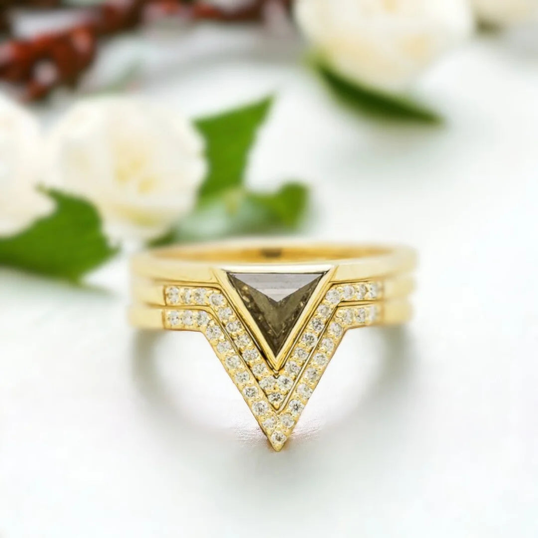 Jenny Triangle Diamond Engagement Ring Modern Geometric 1.25 Ct featuring a triangle-cut salt-and-pepper diamond center stone with black and white inclusions, accented by round side diamonds on a sleek, minimalist band with a clean, contemporary geometric setting