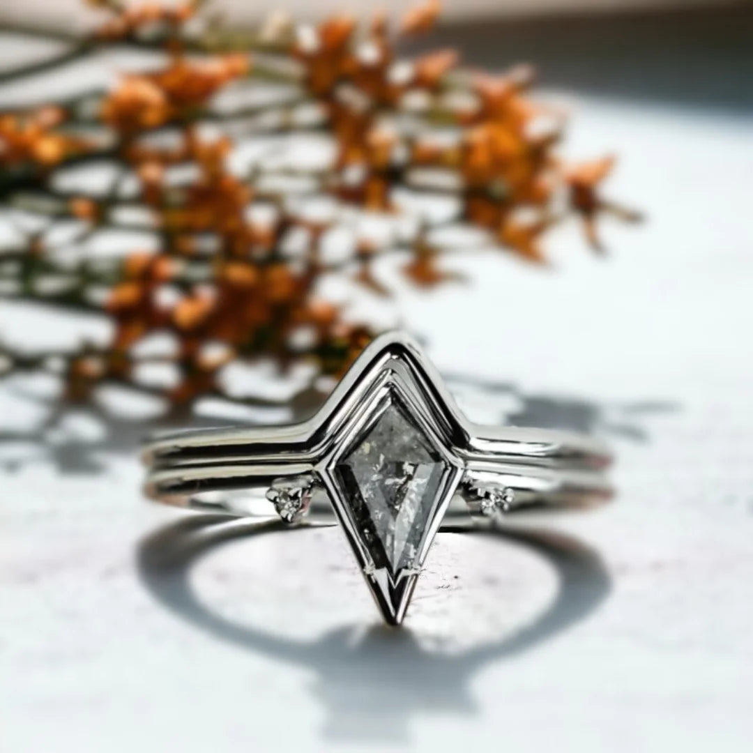 Kite Salt and Pepper Diamond Ring with Grey Side Stones featuring a 0.72 CT kite-cut natural salt-and-pepper diamond with grey round side diamonds in a geometric side stone engagement ring design.