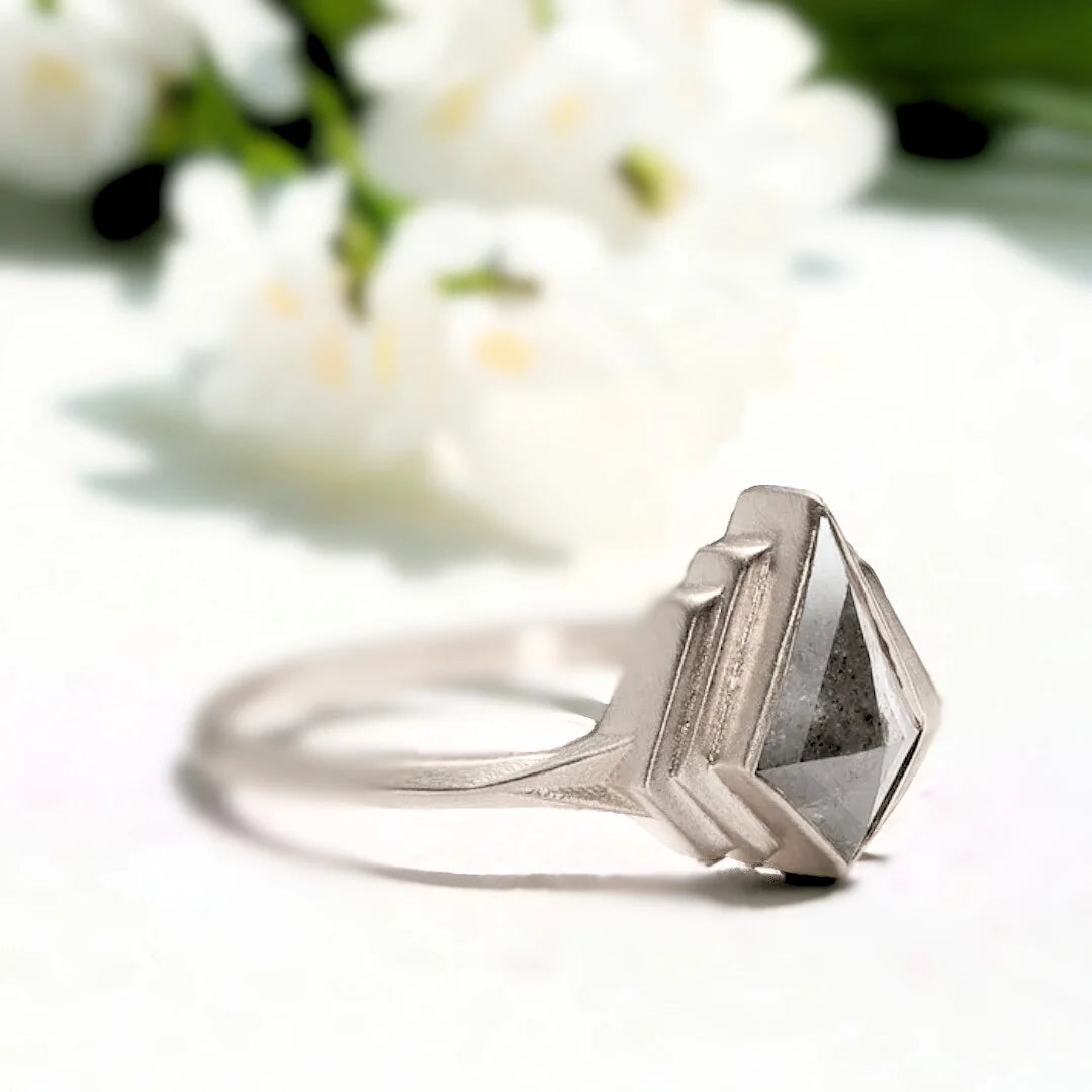 Product image of Kite Shape Salt And Pepper Diamond Engagement Ring Modern Bridal Ring showcasing a natural salt and pepper diamond in a kite cut center stone with organic inclusions, set in a modern sculptural design with a split knife shank band and bold geometric contemporary silhouette.