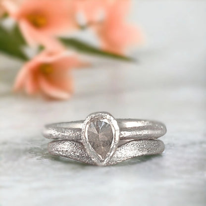 Lab-Grown Salt-and-Pepper Diamond Ring Custom Thalia Gemstone Band featuring a lab-grown salt-and-pepper diamond ring with pear-shaped centre stone, straight shank design, and 2.30mm artisan-crafted band with organic minimalist detailing