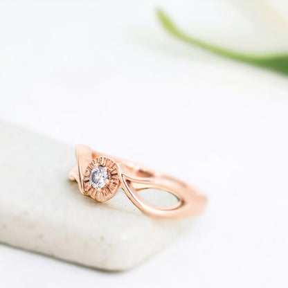 Leaf-inspired Round Diamond Nature Engagement Ring Salt Pepper Stone featuring a round salt-and-pepper diamond in a nature-inspired bypass setting with an organic flowing design and tapered band.