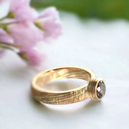 Natural Brown Diamond Ring with Round-Cut Diamond Design featuring a round-cut natural brown diamond in a handcrafted straight shank ring with organic detailing and a minimalist contemporary jewelry style.