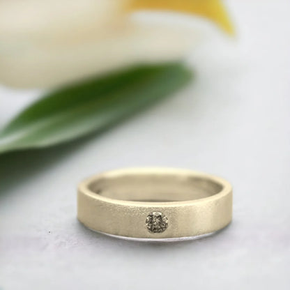 Natural Brown Salt and Pepper Diamond Ring Wedding Band featuring a round-cut brown salt and pepper diamond with organic inclusions in a minimalist wide band ring design with a straight shank and modern, elegant style.