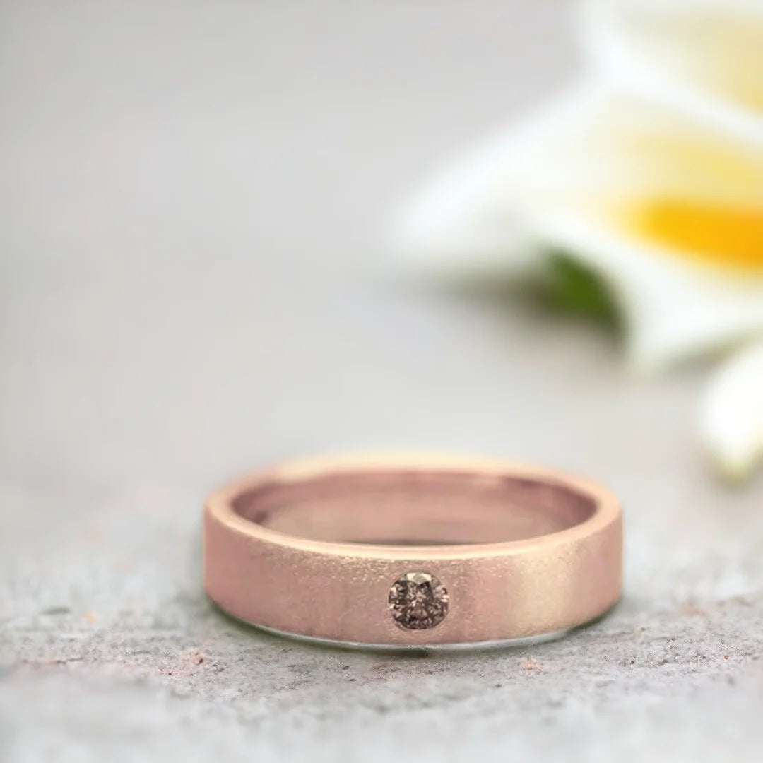 Natural Brown Salt and Pepper Diamond Ring Wedding Band featuring a round-cut brown salt and pepper diamond with organic inclusions in a minimalist wide band ring design with a straight shank and modern, elegant style.