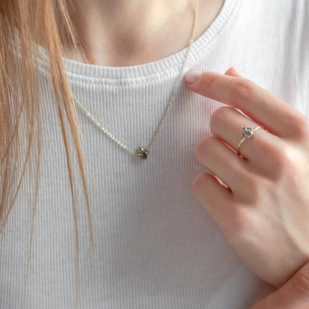 Natural Salt And Pepper Diamond Necklace Mixed Diamond Pendant featuring five round salt and pepper diamonds and one pear shaped diamond in a mixed shape pendant design suspended from a delicate chain with a modern minimalist jewelry style.