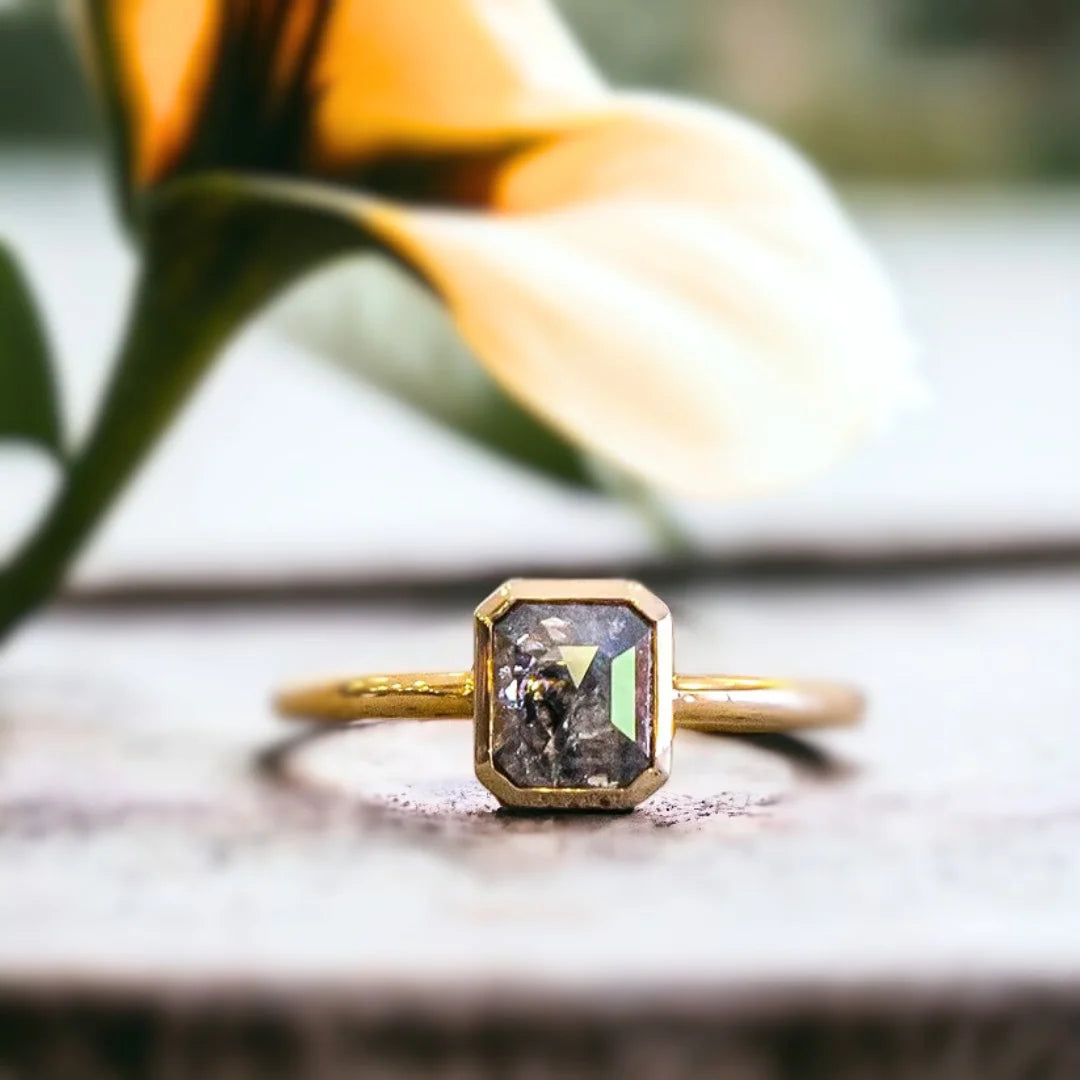 Natural Salt And Pepper Diamond Ring With Emerald Cut Design featuring a 0.84 CT emerald cut salt and pepper diamond in a modern minimalist ring style with a straight shank band and clean geometric silhouette.
