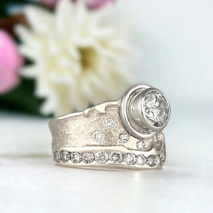 Natural Salt and Pepper Diamond Ring, Nature-Inspired Swirl Design featuring a 1.03 CT round salt and pepper diamond centre stone with galaxy-like inclusions, wide sculptural 11.00mm handcrafted band, round side stones, and a modern organic swirl style setting.