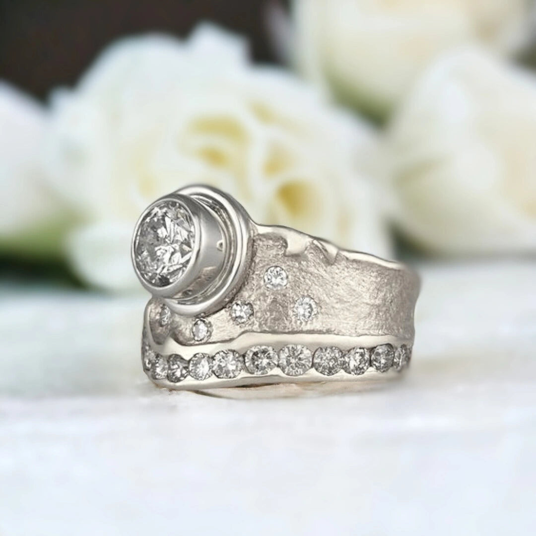 Natural Salt and Pepper Diamond Ring, Nature-Inspired Swirl Design featuring a 1.03 CT round salt and pepper diamond centre stone with galaxy-like inclusions, wide sculptural 11.00mm handcrafted band, round side stones, and a modern organic swirl style setting.