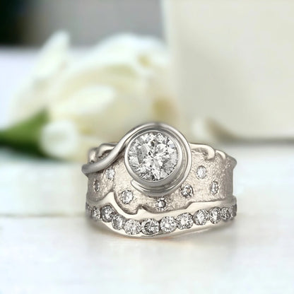 Natural Salt and Pepper Diamond Ring, Nature-Inspired Swirl Design featuring a 1.03 CT round salt and pepper diamond centre stone with galaxy-like inclusions, wide sculptural 11.00mm handcrafted band, round side stones, and a modern organic swirl style setting.